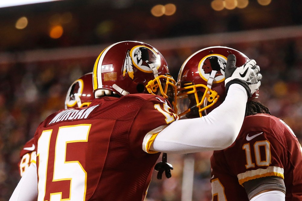Players on the Washington Redskins celebrate after scoring a touchdown during the second half of a NFL football game in Landover, Md., on Dec. 30, 2012. (Photo by Jonathan Ernst/Reuters)