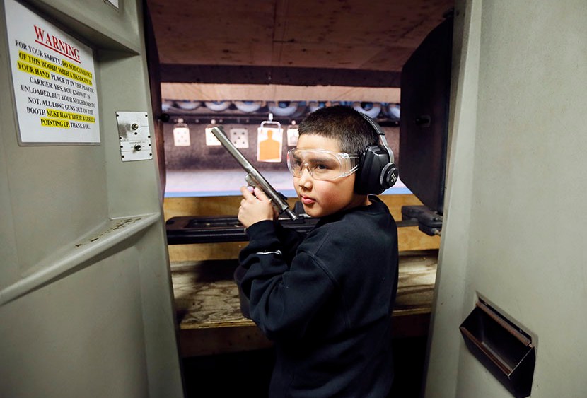 Andrew Josequera, 11, prepares to shoot at a target at the Los Angeles gun club in Los Angeles, January 23, 2013.  (Photo by Lucy Nicholson/Reuters)