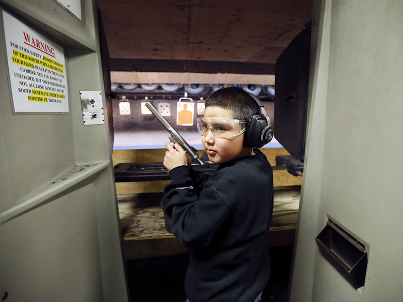 Andrew Josequera, 11, prepares to shoot at a target at the Los Angeles gun club in Los Angeles, January 23, 2013.  (Photo by Lucy Nicholson/Reuters)