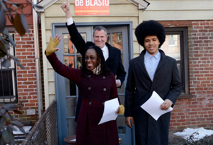 New York City Public Advocate Bill de Blasio (C) waves to supporters with his wife Chirlane McCray (L) and son Dante as they leave their house to announce his Democratic candidacy for mayor in the Brooklyn borough of New York, January 27, 2013. (Photo...