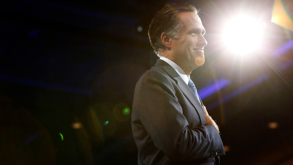 Mitt Romney acknowledges an ovation as he takes the stage for remarks during CPAC in National Harbor, Maryland, March 15, 2013.