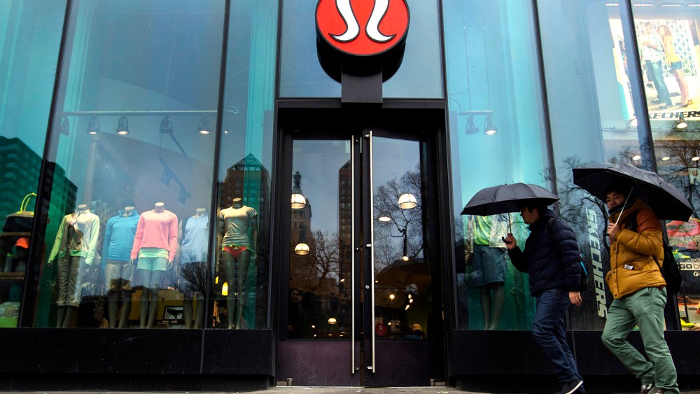 Pedestrians walk past a Lululemon Athletica store, March 19, 2013 in New York, N.Y.