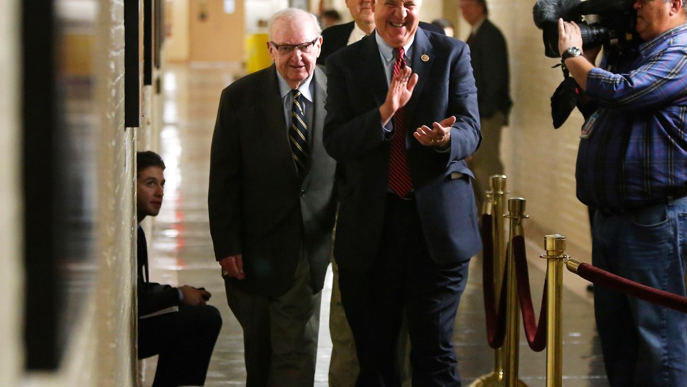 U.S. Representatives Shimkus and Coble arrive for a late night closed-door meeting of the House Republican caucus during a rare Saturday session at the U.S. Capitol