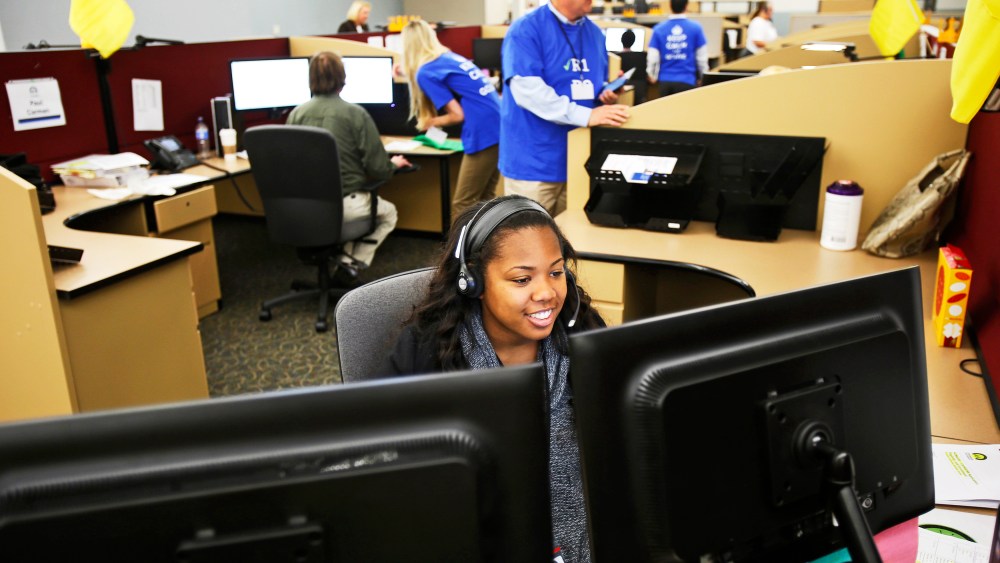 Shaldonia Barney, a service agent at Covered California's Concord call center, takes a call during the opening day of enrollment of the Patient Protection and Affordable Care Act in Concord, California October 1, 2013.