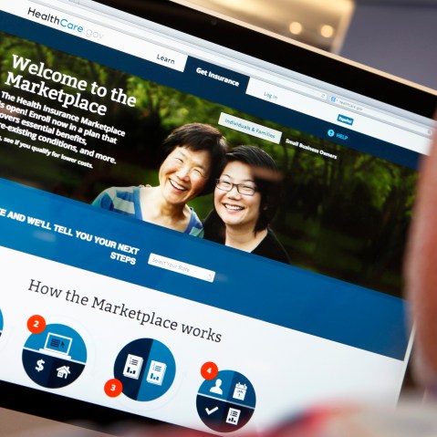 A man looks over the Affordable Care Act (commonly known as Obamacare) signup page on the HealthCare.gov website in New York in this October 2, 2013 photo illustration.