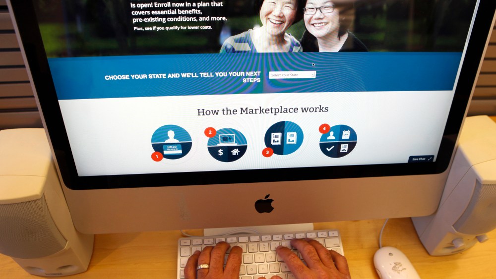 A man looks over the Affordable Care Act signup page on the HealthCare.gov website.