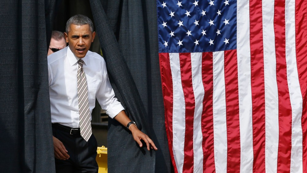 U.S. President Barack Obama arrives to deliver remarks on the government funding impasse at M. Luis Construction, a local small business in Rockville, Maryland, near Washington, October 3, 2013.