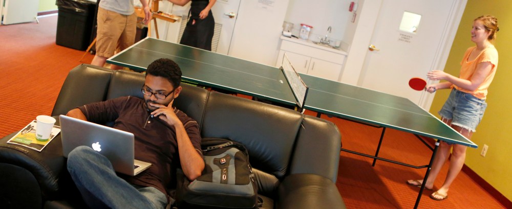 Furloughed federal workers enjoy a game of table tennis at Sixth & I Synagogue's "Shutdown Central"  in Washington October 3, 2013.