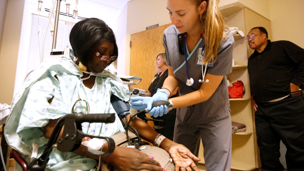 Registered nurse Paige Duracher checks Jacqueline Parker's vitals at the University of Mississippi Medical Center in Jackson, Mississippi October 4, 2013.