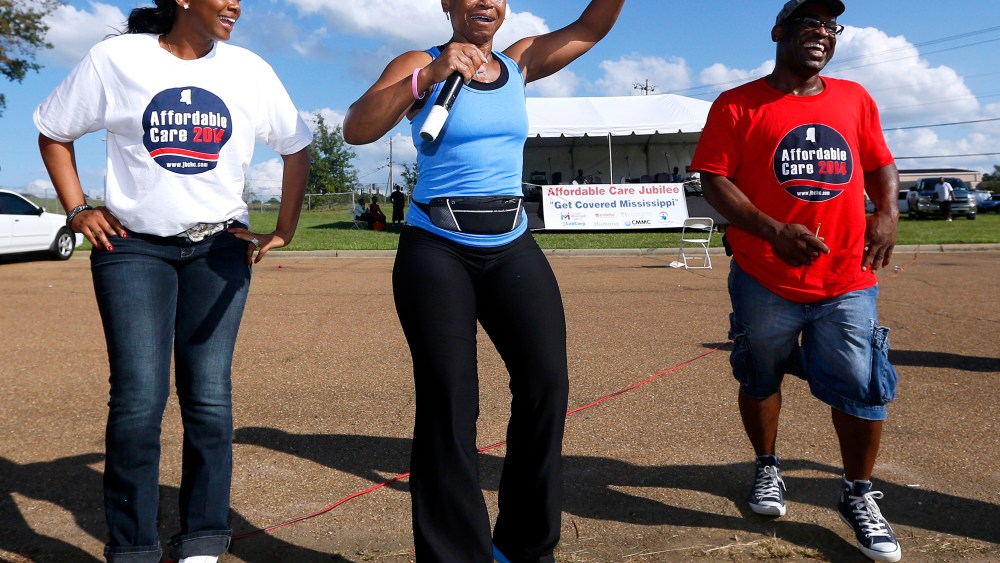 Deborah Jones leads local residents in an exercise at a rally held by supporters of the Affordable Care Act outside the Jackson-Hinds Comprehensive Health Center in Jackson, Mississippi October 4, 2013.