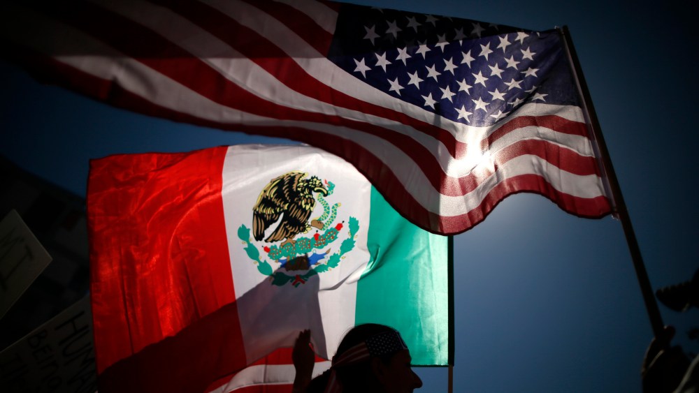 Protesters carry American and Mexican flags on their march to demand immigration reform in Hollywood