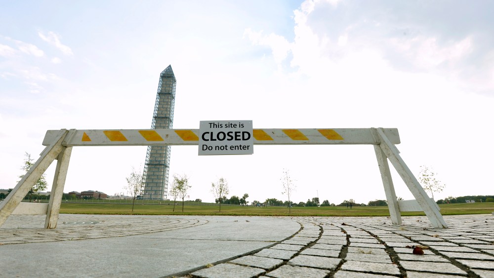 A barrier sits near the Washington Monument October 5, 2013, as the government shutdown continues into the weekend.