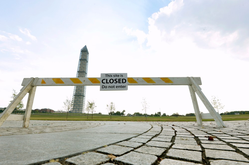 A barrier sits near the Washington Monument October 5, 2013, as the government shutdown continues into the weekend.