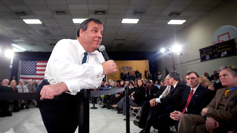 New Jersey Governor Chris Christie listens to a question as he leans on a pole during a town hall meeting in Sterling, N.J. on Feb. 26, 2014.