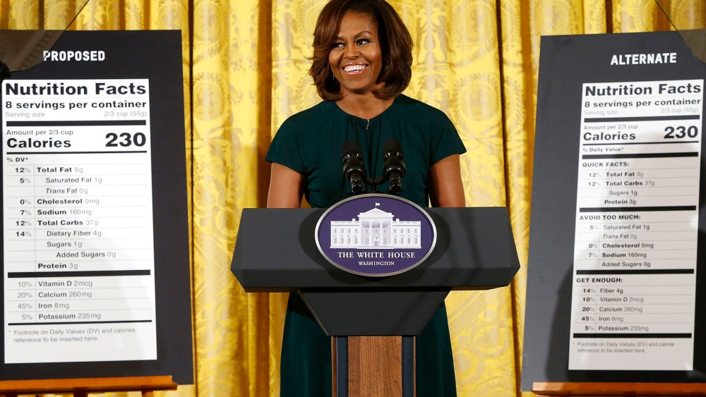 U.S. first lady Michelle Obama smiles as she unveils proposed updates to nutrition facts labels, Feb. 27, 2014.