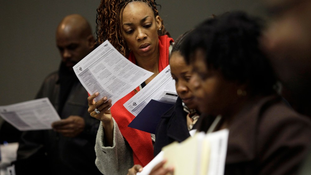 People attend a job fair in Detroit, Michigan, Mar. 1, 2014.
