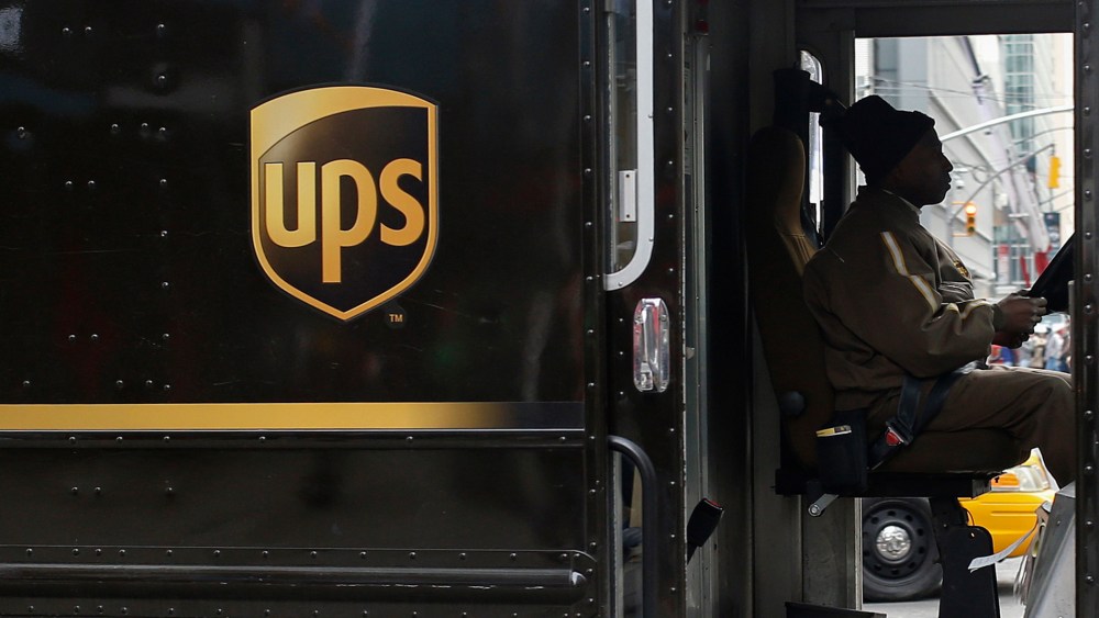 A UPS delivery truck makes its way through Times Square in New York on March 5, 2014.