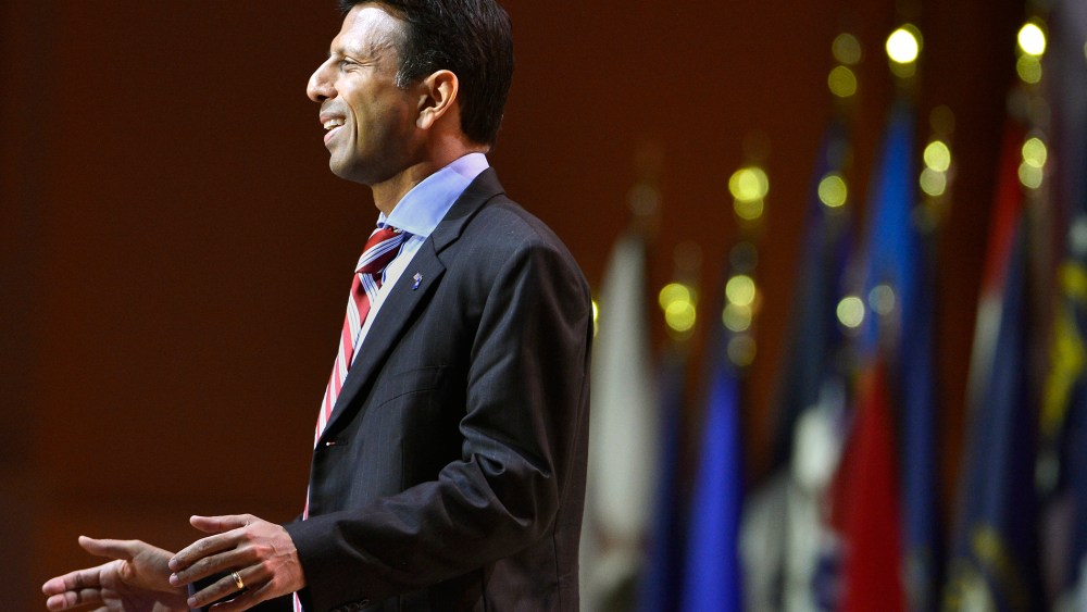 Louisiana Gov. Bobby Jindal greets guests as he arrives to address the Conservative Political Action Conference (CPAC) in Oxon Hill, Md., March 6, 2014. (Photo by Mike Theiler/Reuters)
