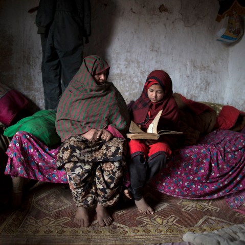 Tadjroshan, 40, poses for a photograph with her daughter Ayman, 12, at their house in a slum on the outskirts of Islamabad February 4, 2014. (Photo by Zohra Bensemra/Reuters)