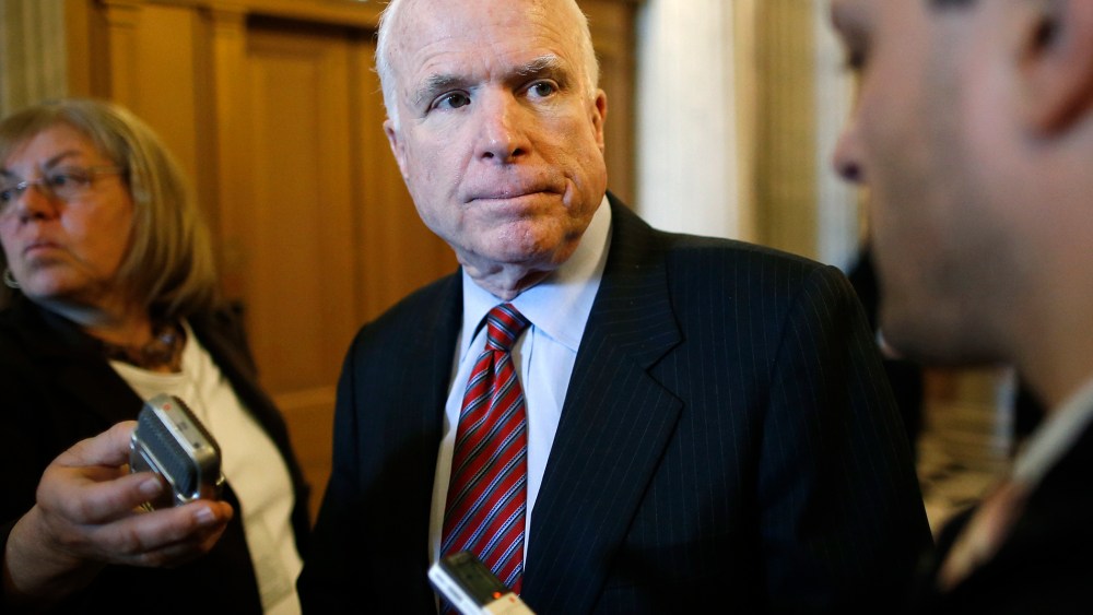U.S. Senator John McCain (R-Ariz.) takes questions from reporters after the weekly Republican caucus luncheon at the U.S. Capitol in Washington March 11, 2014.