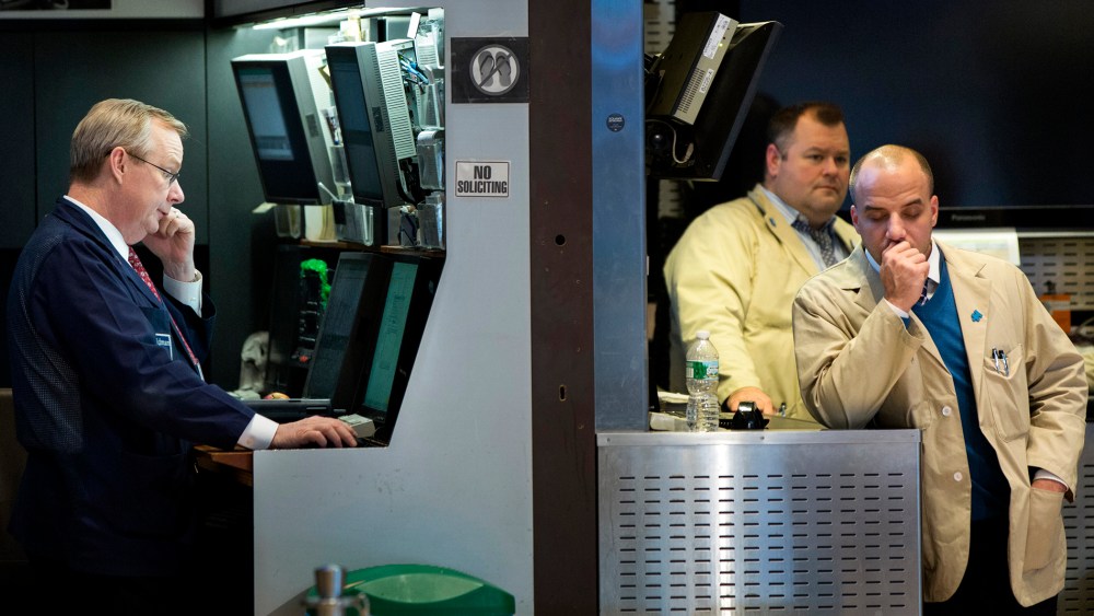 Traders work on the floor of the New York Stock Exchange
