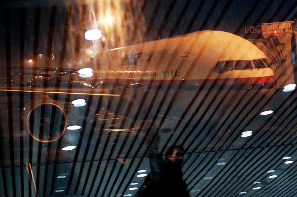 Malaysia Airlines Boeing 777-200ER flight MH318 to Beijing sits on the tarmac at the boarding gate at Kuala Lumpur International Airport at approximately on March 17, 2014.