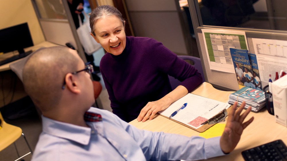 Natalia Pollack, uninsured since 1999, is assisted to sign up for health insurance through the Affordable Care Act, by Carlos Tapia, a certified application councilor in New York City, March 31, 2014.