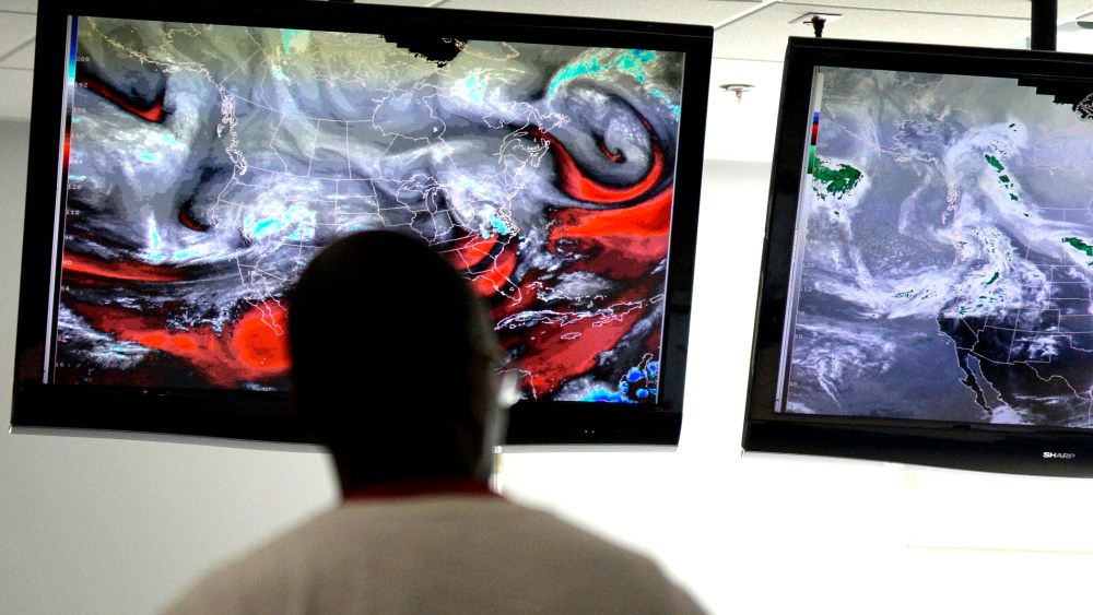 NOAA/SPC Severe weather forecasters keep track of the latest radar models at the National Weather Center in Norman, Okla. on April 25, 2014.