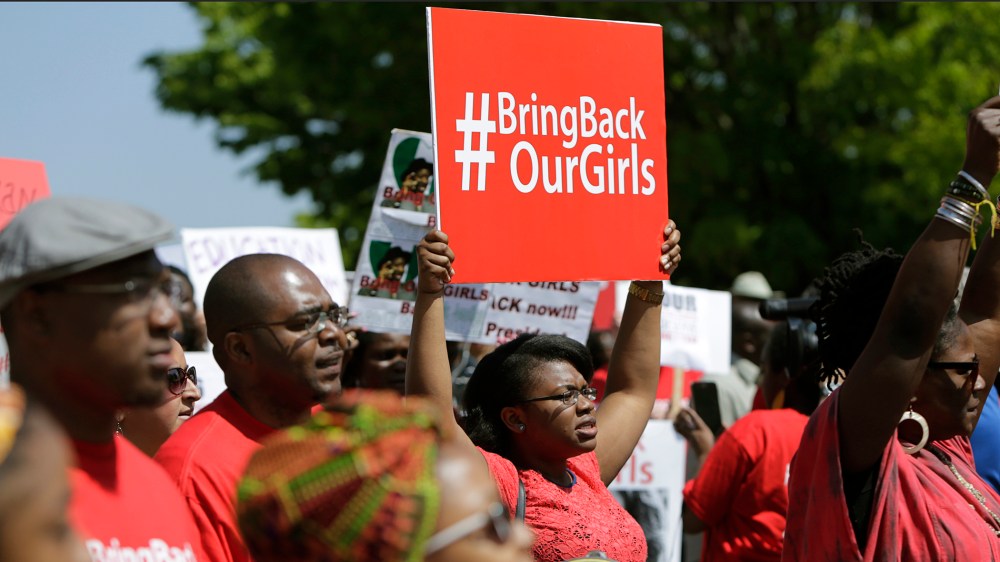 Protesters march in support of the girls kidnapped by members of Boko Haram in front of the Nigerian Embassy in Washington