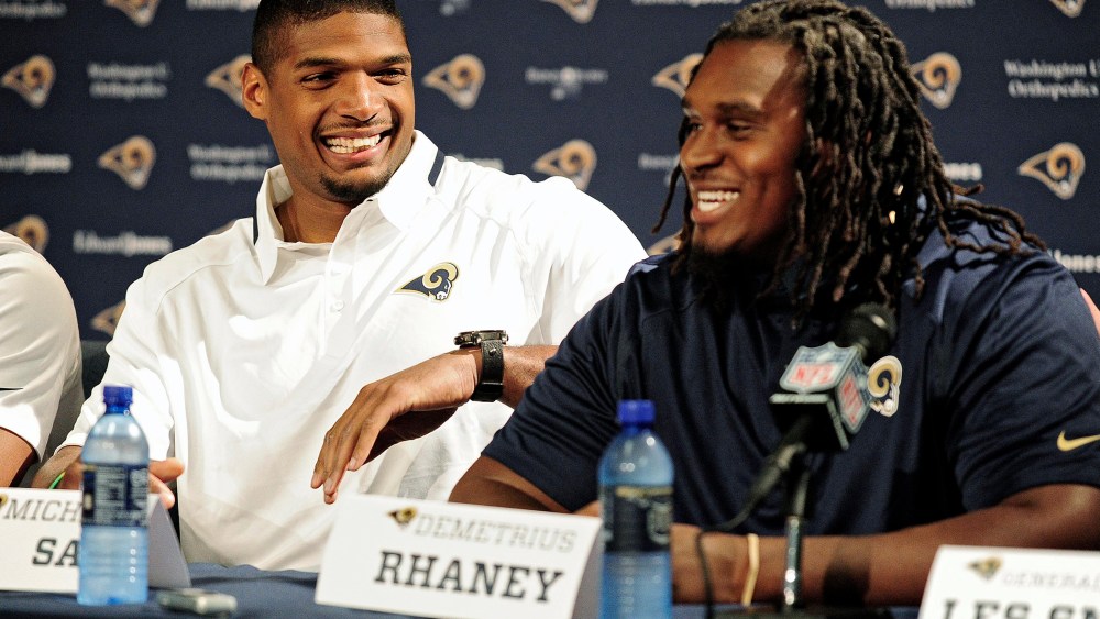 Michael Sam (left) jokes around with seventh round pick offensive lineman Demetrius Rhaney during a press conference at Rams Park on May 13, 2014 in St. Louis, Mo.