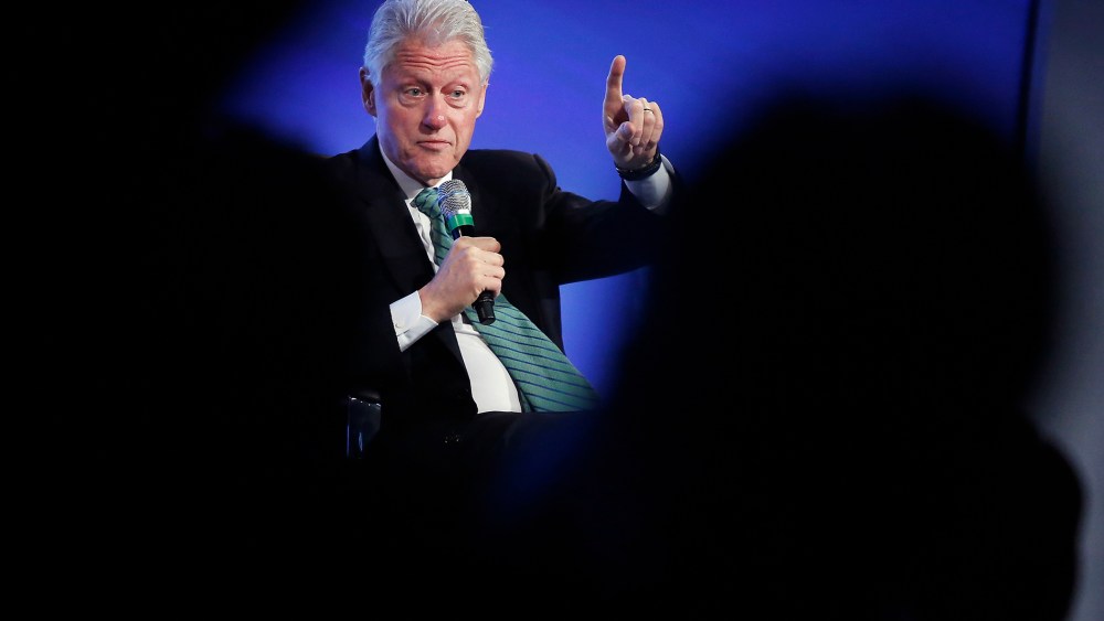 Former U.S. President Bill Clinton gestures during an onstage interview at the 2014 Peterson Foundation Fiscal Summit in Washington May 14, 2014.