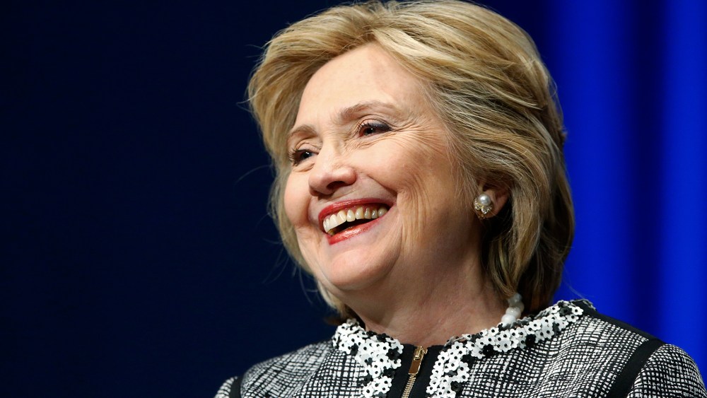 Former U.S. Secretary of State Hillary Clinton smiles during a lengthy ovation for her at the start of an event on empowering woman and girls, at the World Bank in Washington May 14, 2014.