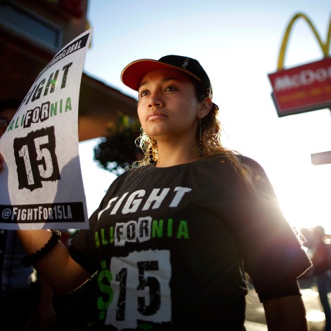 Demonstrators take part in a protest to demand higher wages for fast-food workers outside McDonald's in Los Angeles, Cali. on May 15, 2014.