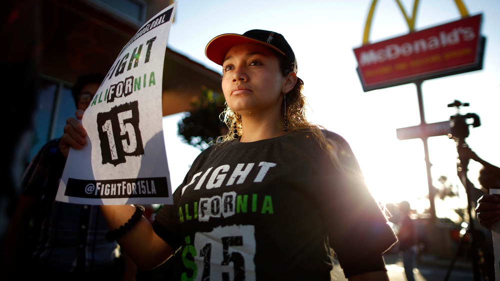 Demonstrators take part in a protest to demand higher wages for fast-food workers outside McDonald's in Los Angeles, Cali. on May 15, 2014.