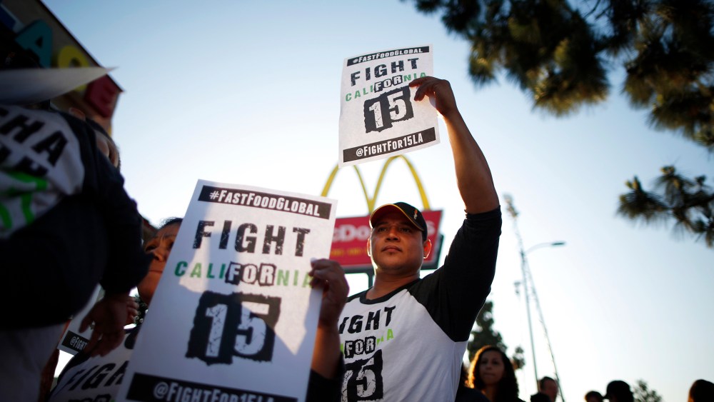 Demonstrators take part in a protest to demand higher wages for fast-food workers outside McDonald's in Los Angeles, Calif., on May 15, 2014. (Photo by Lucy Nicholson/Reuters)