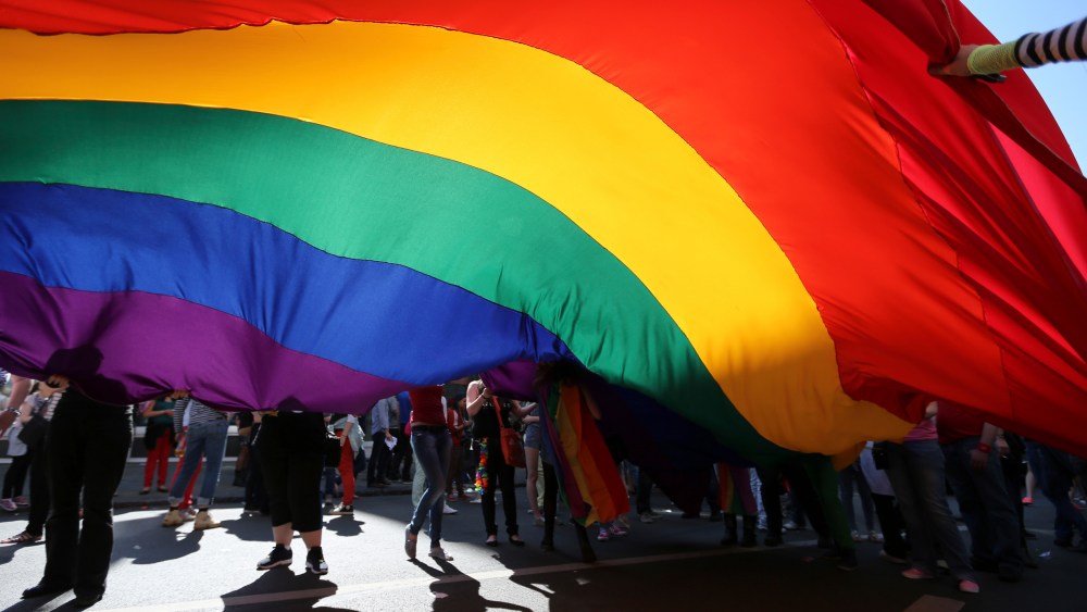 Participants hold a giant rainbow flag during the Brussels LGBT Pride Parade on May 17, 2014.