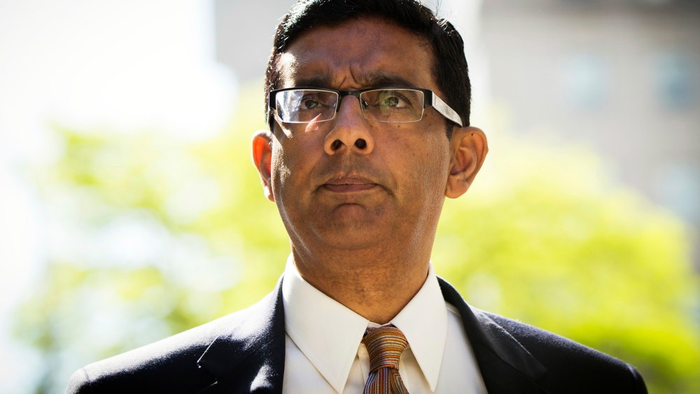 Conservative commentator and best-selling author, Dinesh D'Souza exits the Manhattan Federal Courthouse after pleading guilty in New York on May 20, 2014. (Photo by Lucas Jackson/Reuters)