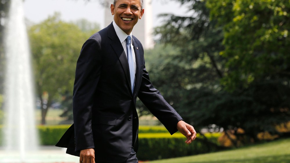 U.S. President Barack Obama smiles as he walks away from Marine One on the South Lawn at the White House in Washington, D.C., May 28, 2014.