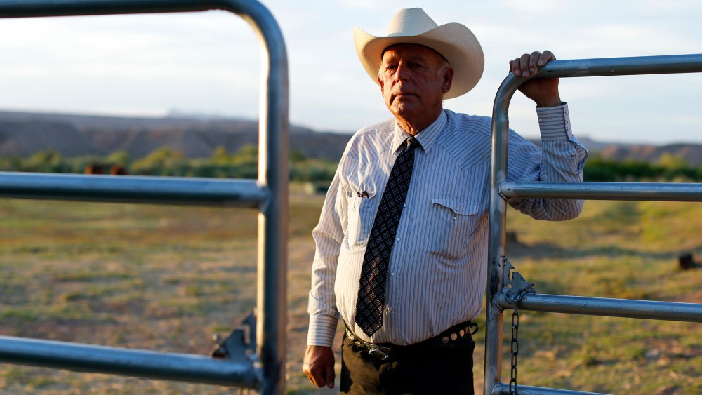 Rancher Cliven Bundy stands near a metal gate on his 160 acre ranch in Bunkerville, Nevada on May 3, 2014. (Photo by Mike Blake/Reuters)