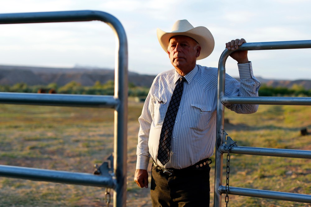 Rancher Cliven Bundy stands near a metal gate on his 160 acre ranch in Bunkerville, Nevada on May 3, 2014. (Photo by Mike Blake/Reuters)