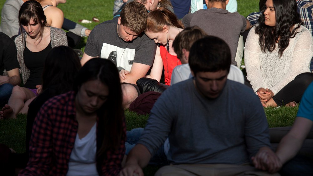 Students pray together after a shooting on campus at Seattle Pacific University in Washington