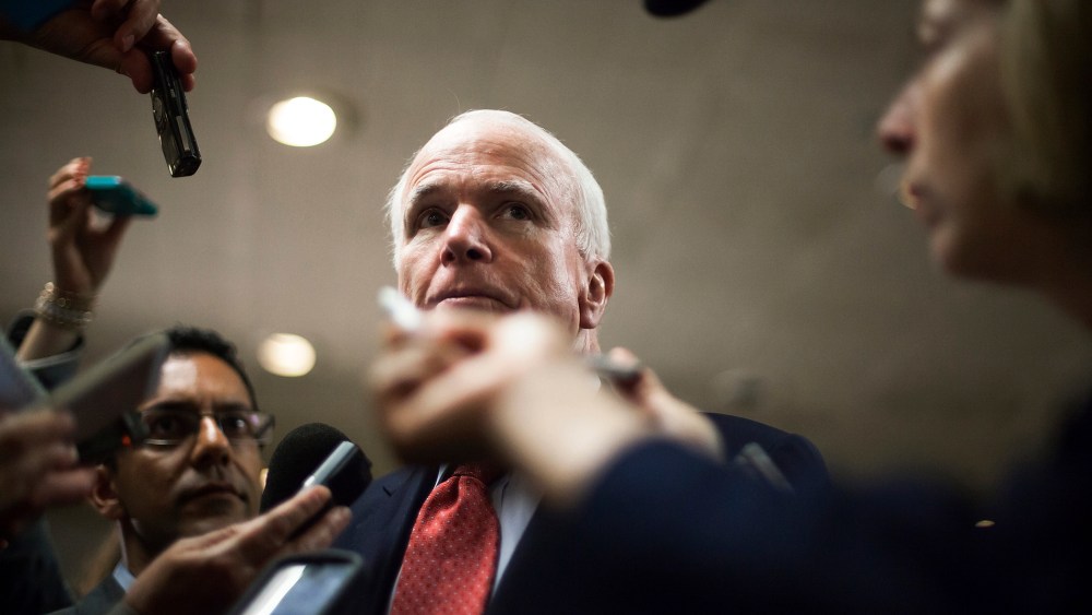 U.S. Senator John McCain talks to reporters at the U.S. Capitol in Washington, June 10, 2014.