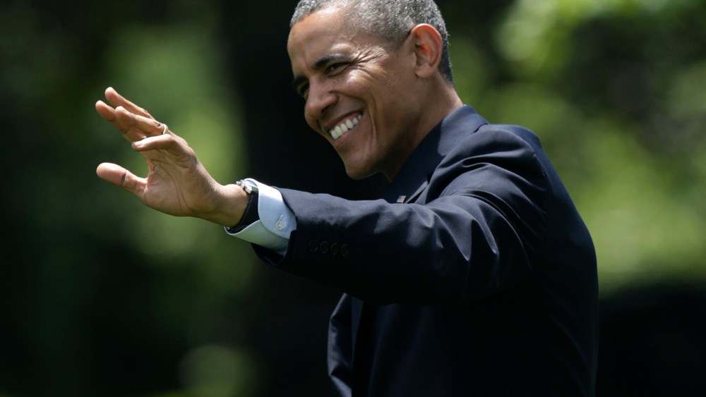 United States President Obama waves as he departs the White House on the South Lawn in Washington