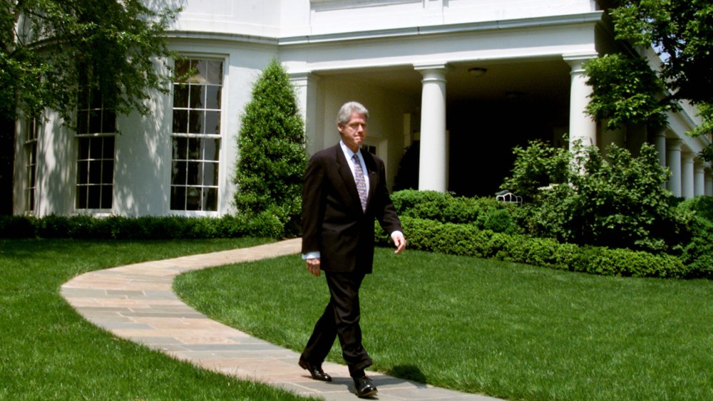 U.S. President Bill Clinton walks out of the Oval Office at the White House on his way to make a statement about the economy, May 5, 2000.