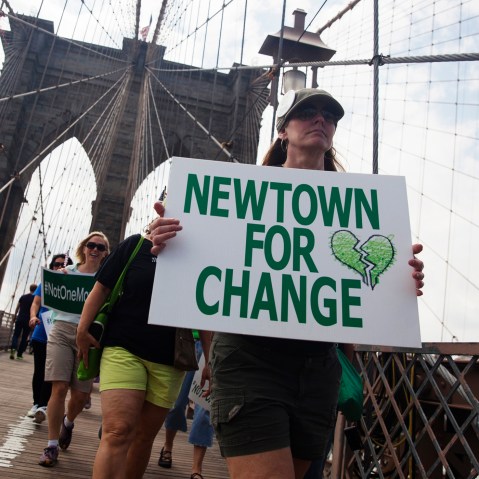 Demonstrators from various groups march across the Brooklyn Bridge in a protest calling for tougher gun control laws, in New York on June 14, 2014. (John Taggart/Reuters)