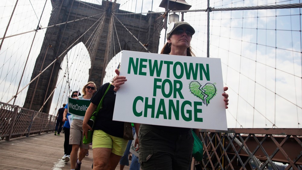 Demonstrators from various groups march across the Brooklyn Bridge in a protest calling for tougher gun control laws, in New York on June 14, 2014. (John Taggart/Reuters)