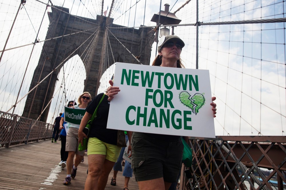Demonstrators from various groups march across the Brooklyn Bridge in a protest calling for tougher gun control laws, in New York on June 14, 2014. (John Taggart/Reuters)