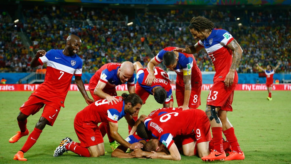 Team U.S.A celebrate during the 2014 World Cup Group G soccer match between Ghana and the U.S. at the Dunas arena