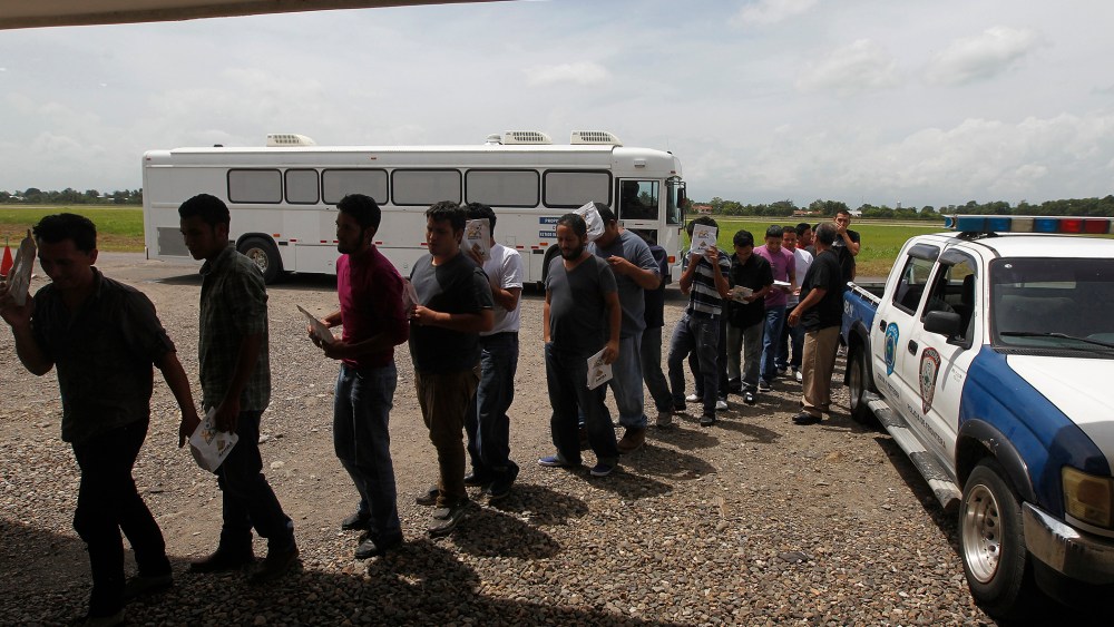 Deportees line up at the Care Center for Returning Migrants (CAMR) after arriving on an immigration flight from the U.S., at the international airport in San Pedro Sula