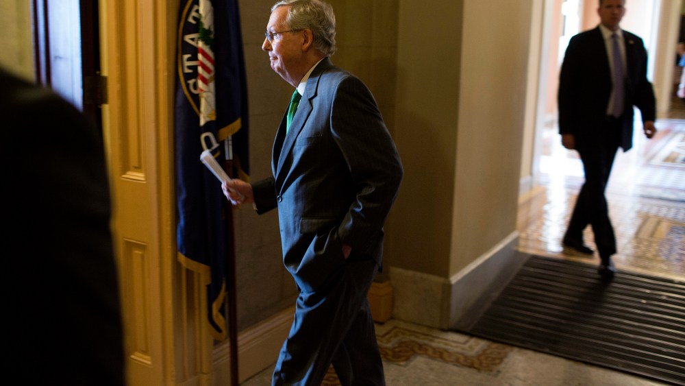 Senate Minority Leader McConnell (R-KY) returns to his office after the Republican caucus meeting on Capitol Hill in Washington